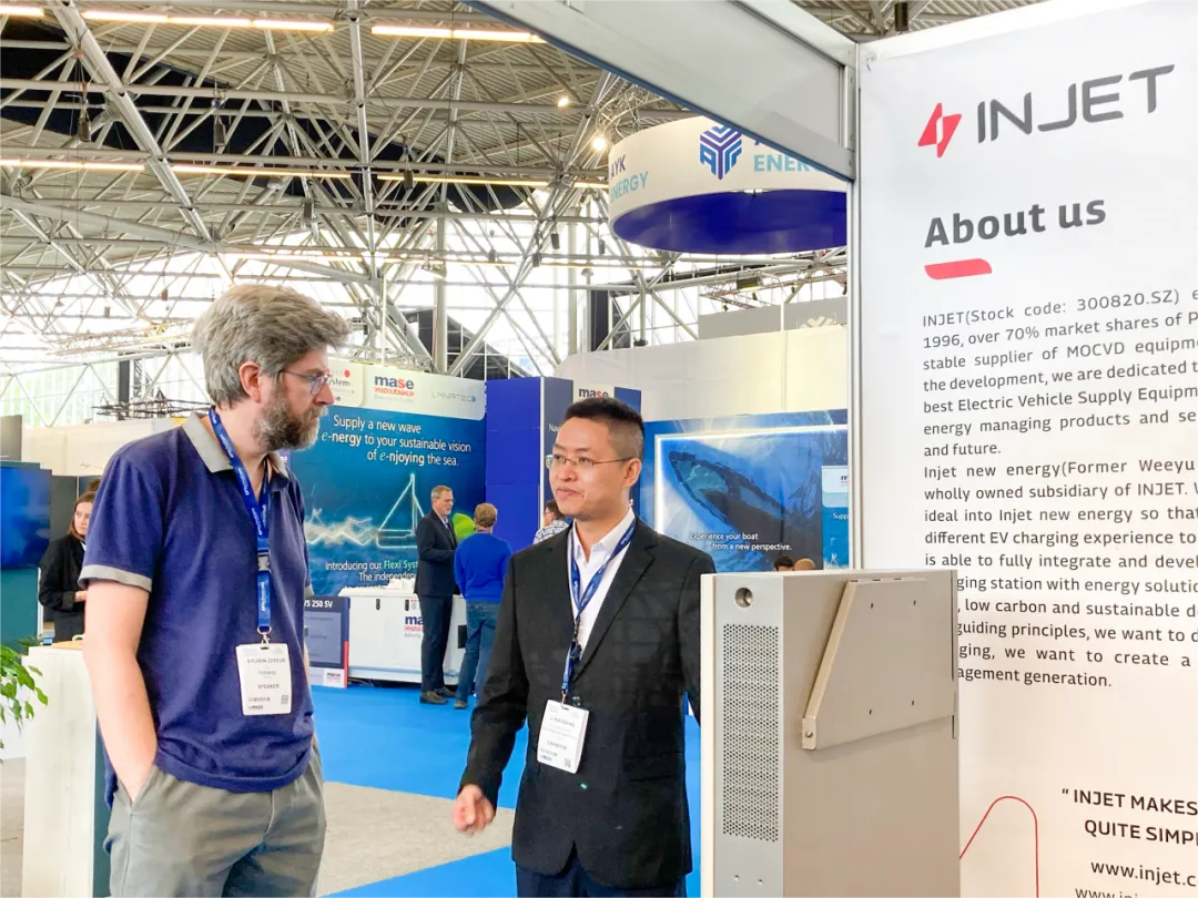 The team of Injet New Energy is explaining the products  with visitors
